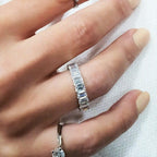 14k gold emerald lab grown diamond eternity band, styled on model showing fine craftsmanship