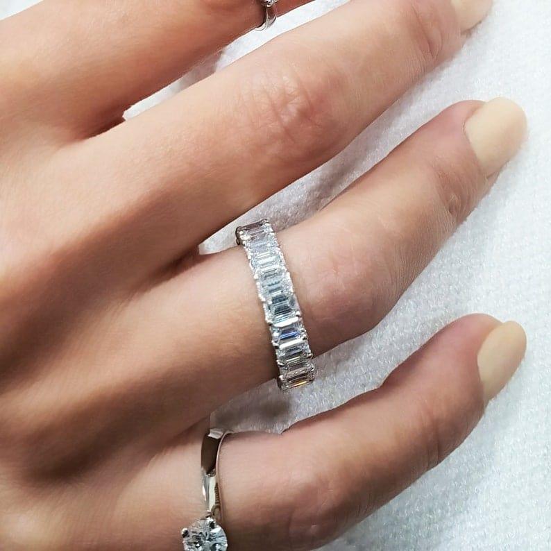 14k gold emerald lab grown diamond eternity band, styled on model showing fine craftsmanship