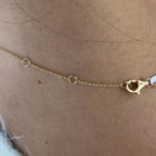 14k yellow gold round pave-set lab grown diamond necklace, styled on model showing fine craftsmanship