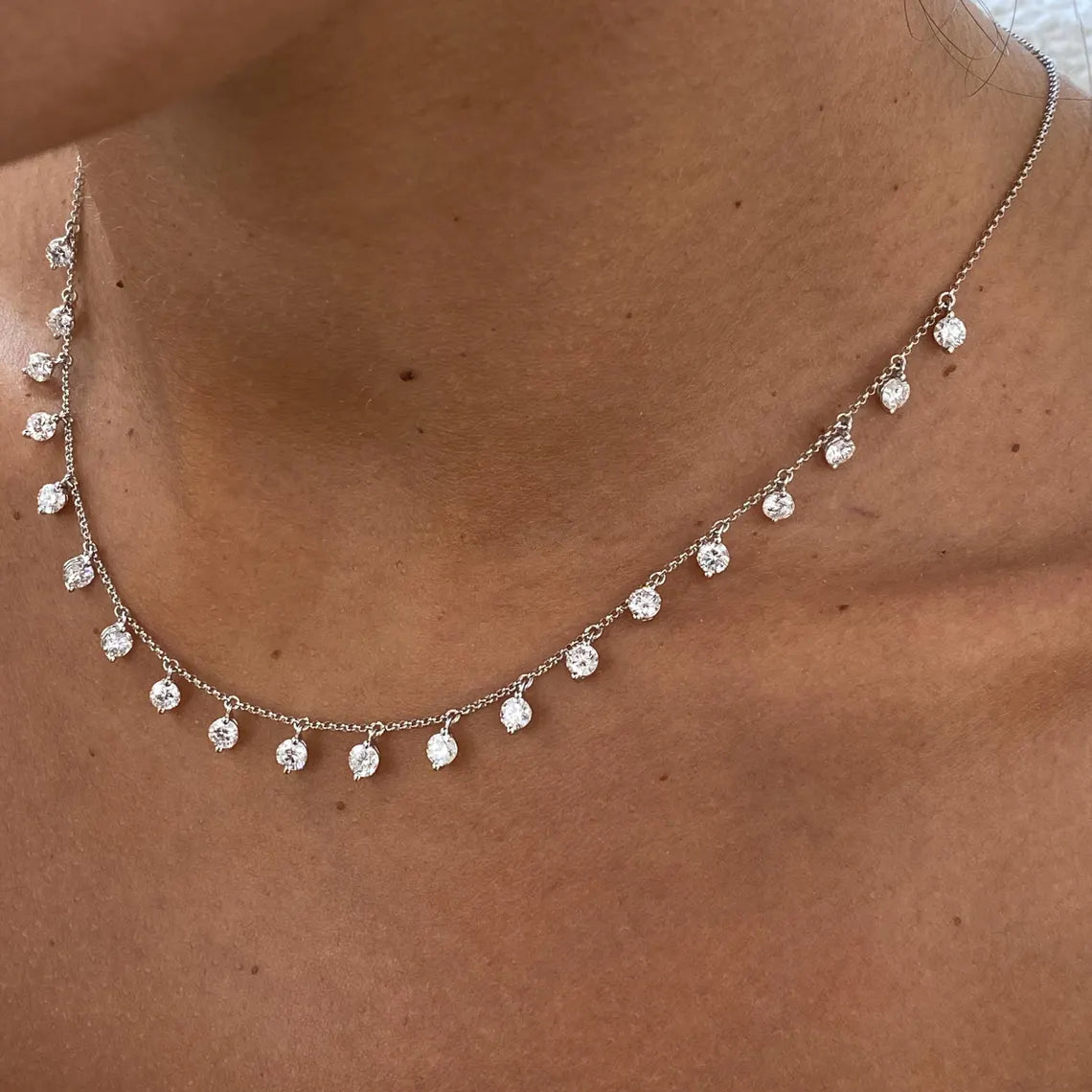 14k gold round prong-set lab grown diamond necklace, top angle view showing fine craftsmanship