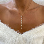 14k yellow gold oval prong-set lab grown diamond necklace, side profile view showing fine craftsmanship