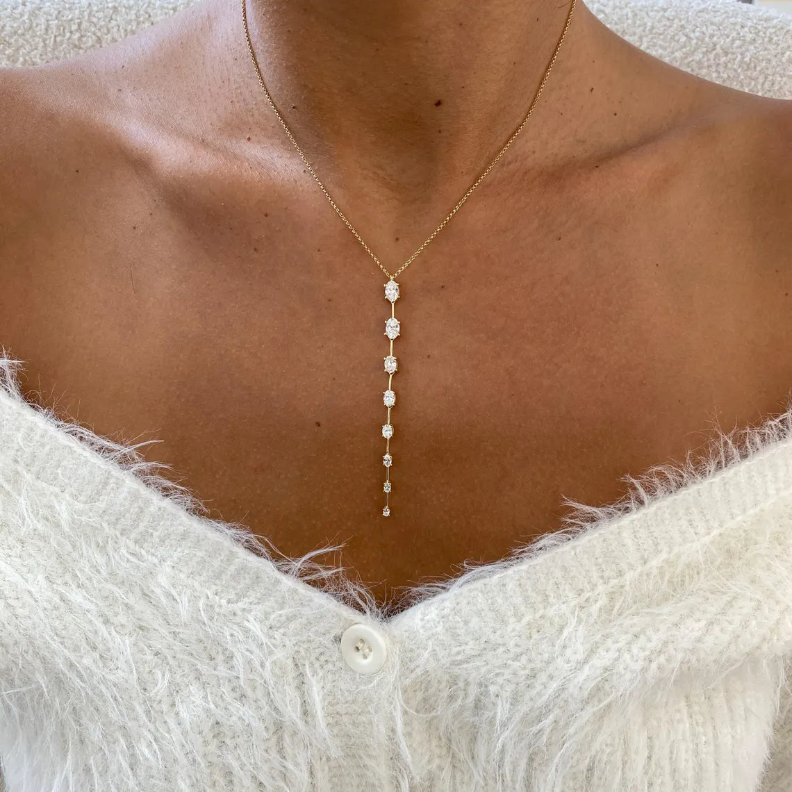 14k yellow gold oval prong-set lab grown diamond necklace, side profile view showing fine craftsmanship