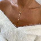 14k yellow gold oval prong-set lab grown diamond necklace, styled on model showing fine craftsmanship