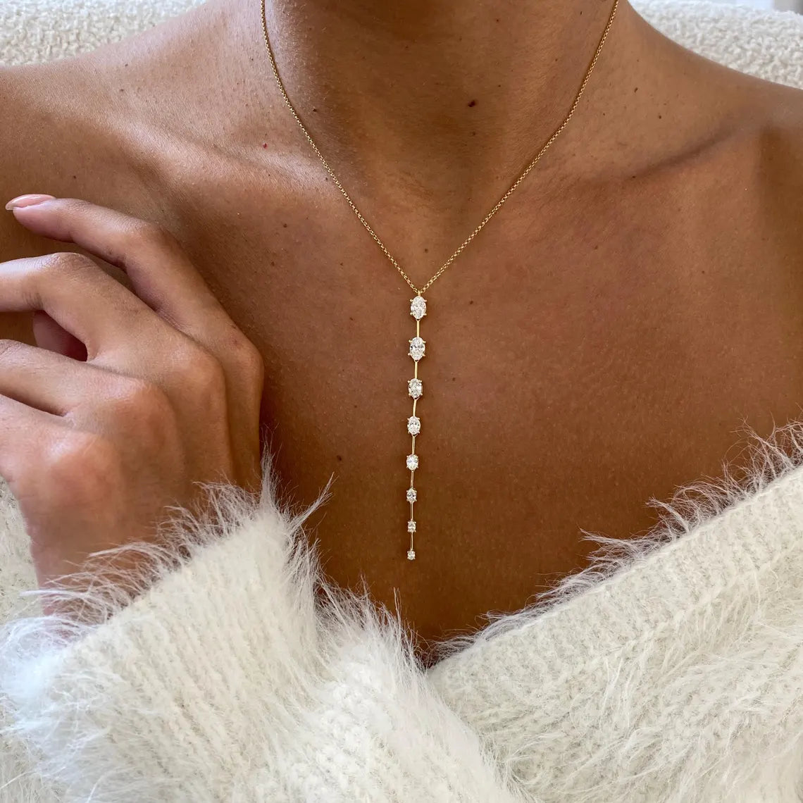 14k yellow gold oval prong-set lab grown diamond necklace, top angle view showing fine craftsmanship
