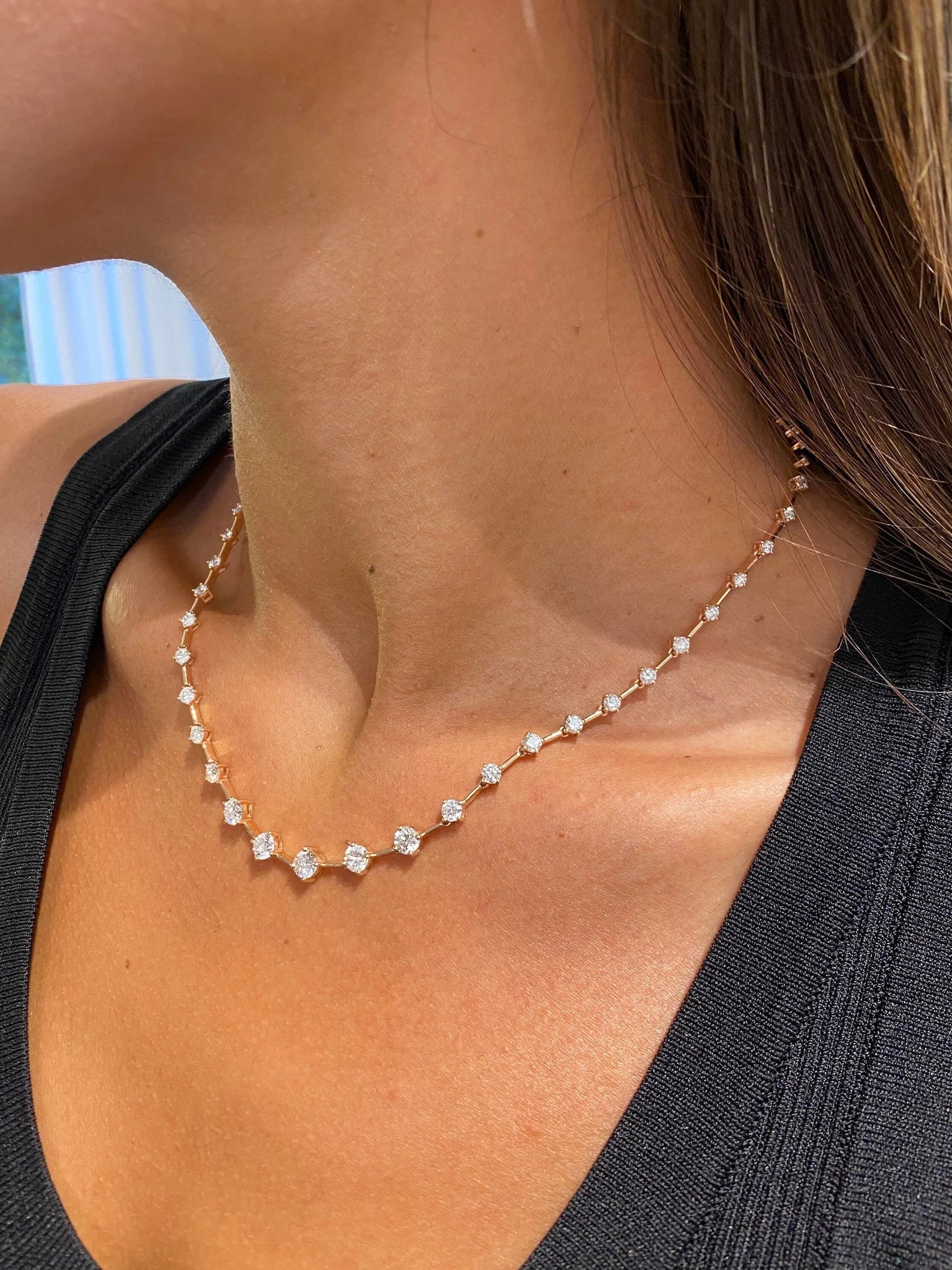 14k rose gold round tennis lab grown diamond necklace, styled on model showing fine craftsmanship