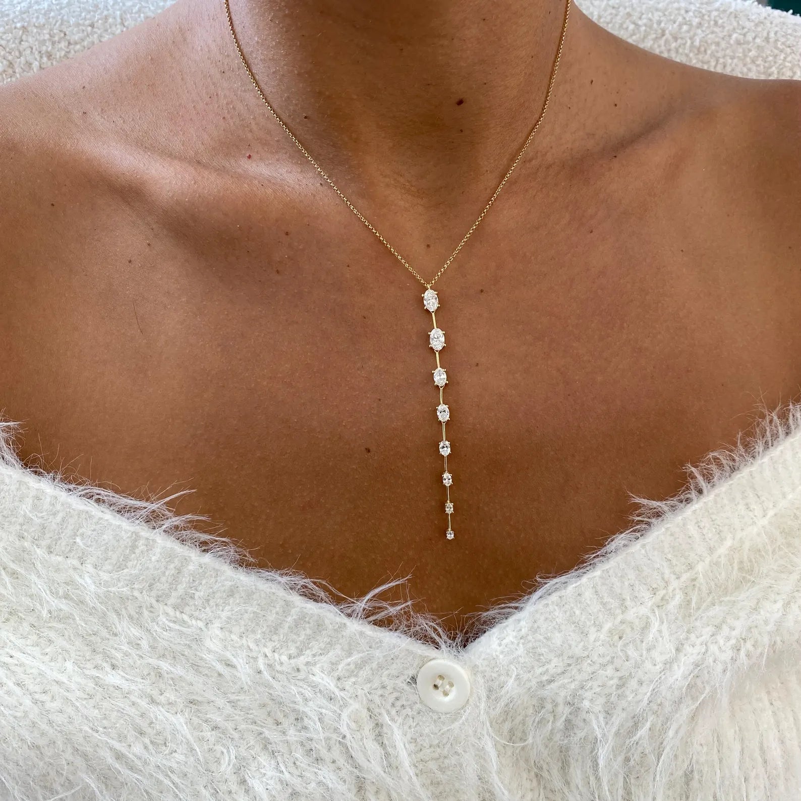 14k yellow gold oval prong-set lab grown diamond necklace, three-quarter view showing fine craftsmanship
