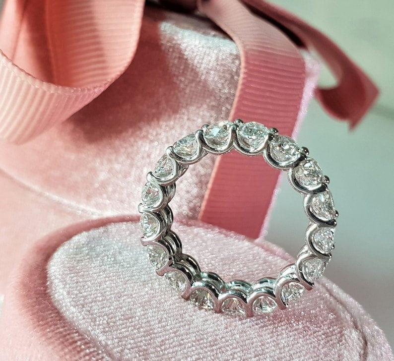 14k gold oval lab grown diamond eternity band, styled on model showing fine craftsmanship