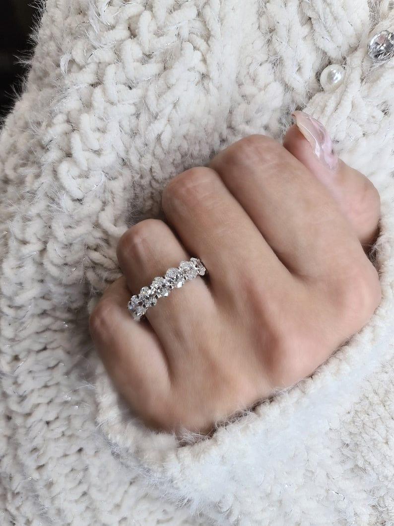 14k gold oval lab grown diamond eternity band, detailed close-up showing fine craftsmanship