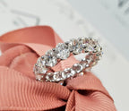 14k gold oval lab grown diamond eternity band, three-quarter view showing fine craftsmanship