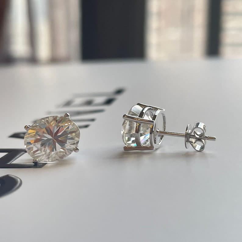 14k gold oval screw back lab grown diamond stud earrings, styled on model showing fine craftsmanship