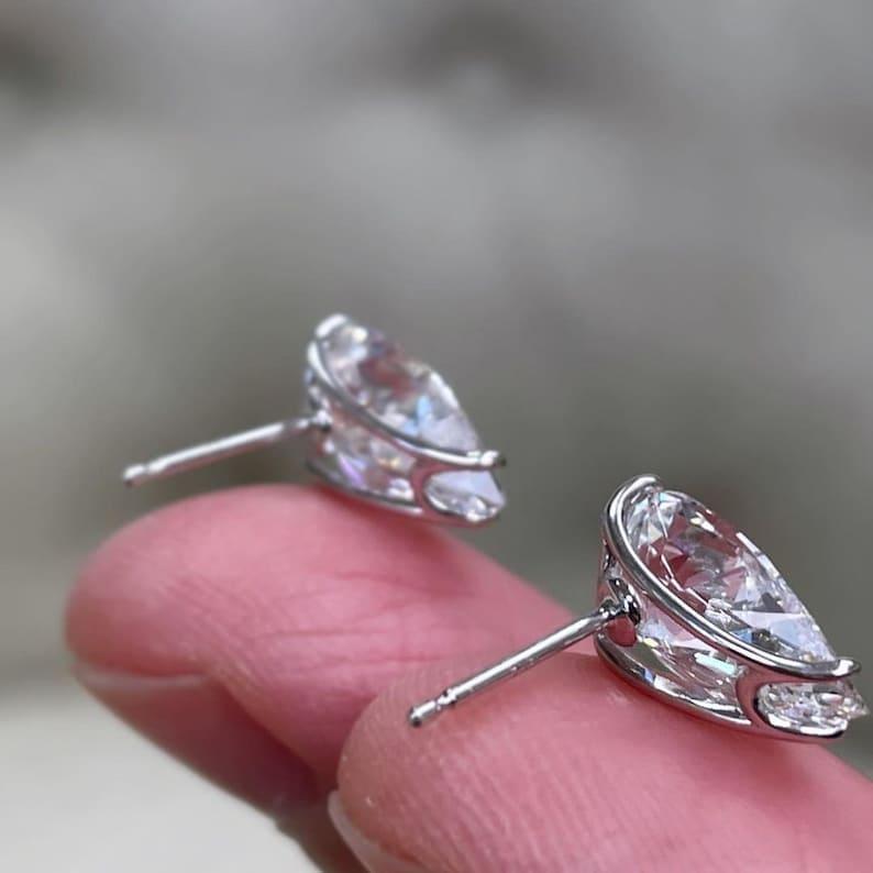14k gold pear screw back lab grown diamond stud earrings, top angle view showing fine craftsmanship