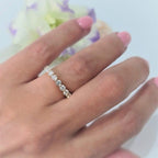 14k gold round lab grown diamond eternity band, detailed close-up showing fine craftsmanship
