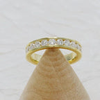 14k gold round channel-set lab grown diamond wedding band, detailed close-up showing fine craftsmanship