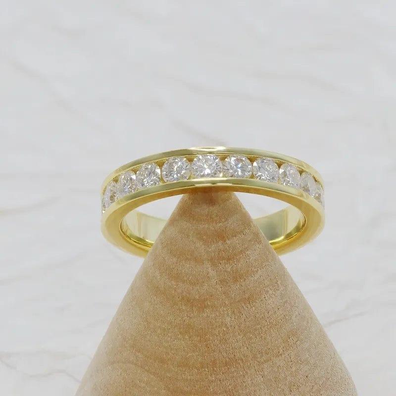 14k gold round channel-set lab grown diamond wedding band, detailed close-up showing fine craftsmanship