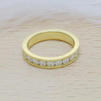 14k gold round channel-set lab grown diamond wedding band, top angle view showing fine craftsmanship