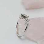 14k gold round dainty lab grown diamond wedding band, styled on model showing fine craftsmanship