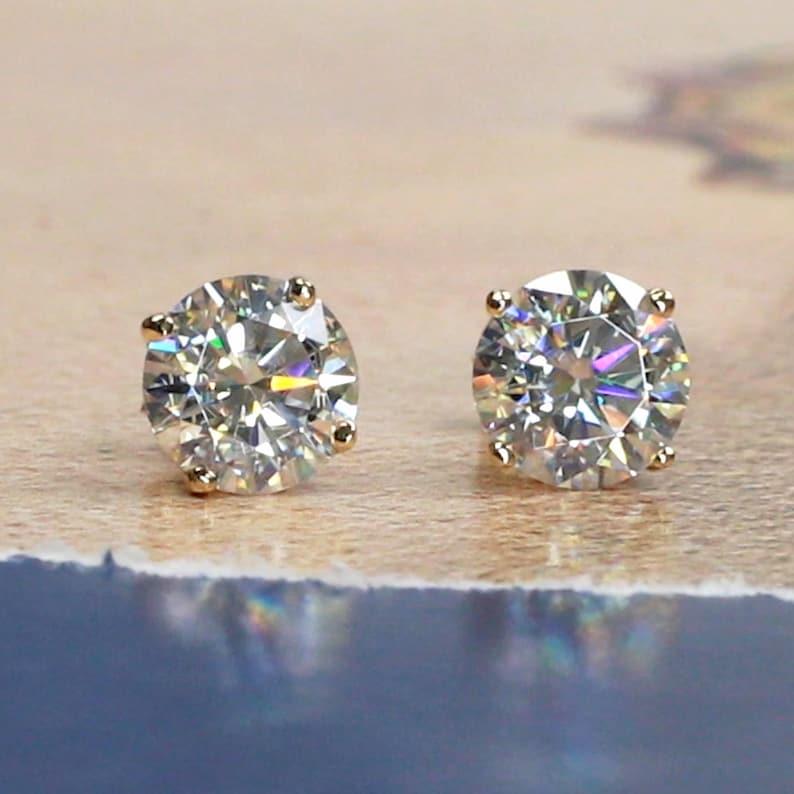 14k gold round prong-set lab grown diamond stud earrings, angled studio shot showing fine craftsmanship