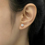 14k gold round prong-set lab grown diamond stud earrings, top angle view showing fine craftsmanship