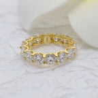 14k gold round lab grown diamond eternity band, front view showing fine craftsmanship with brilliant sparkle