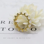 14k gold round lab grown diamond eternity band, side profile view showing fine craftsmanship with brilliant sparkle