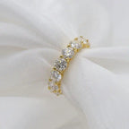 14k gold round lab grown diamond eternity band, styled on model showing fine craftsmanship