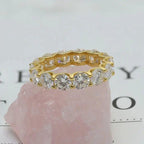 14k gold round lab grown diamond eternity band, top angle view showing fine craftsmanship