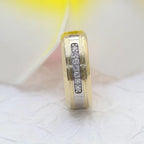 14k gold round two-tone lab grown diamond wedding band, detailed close-up showing fine craftsmanship